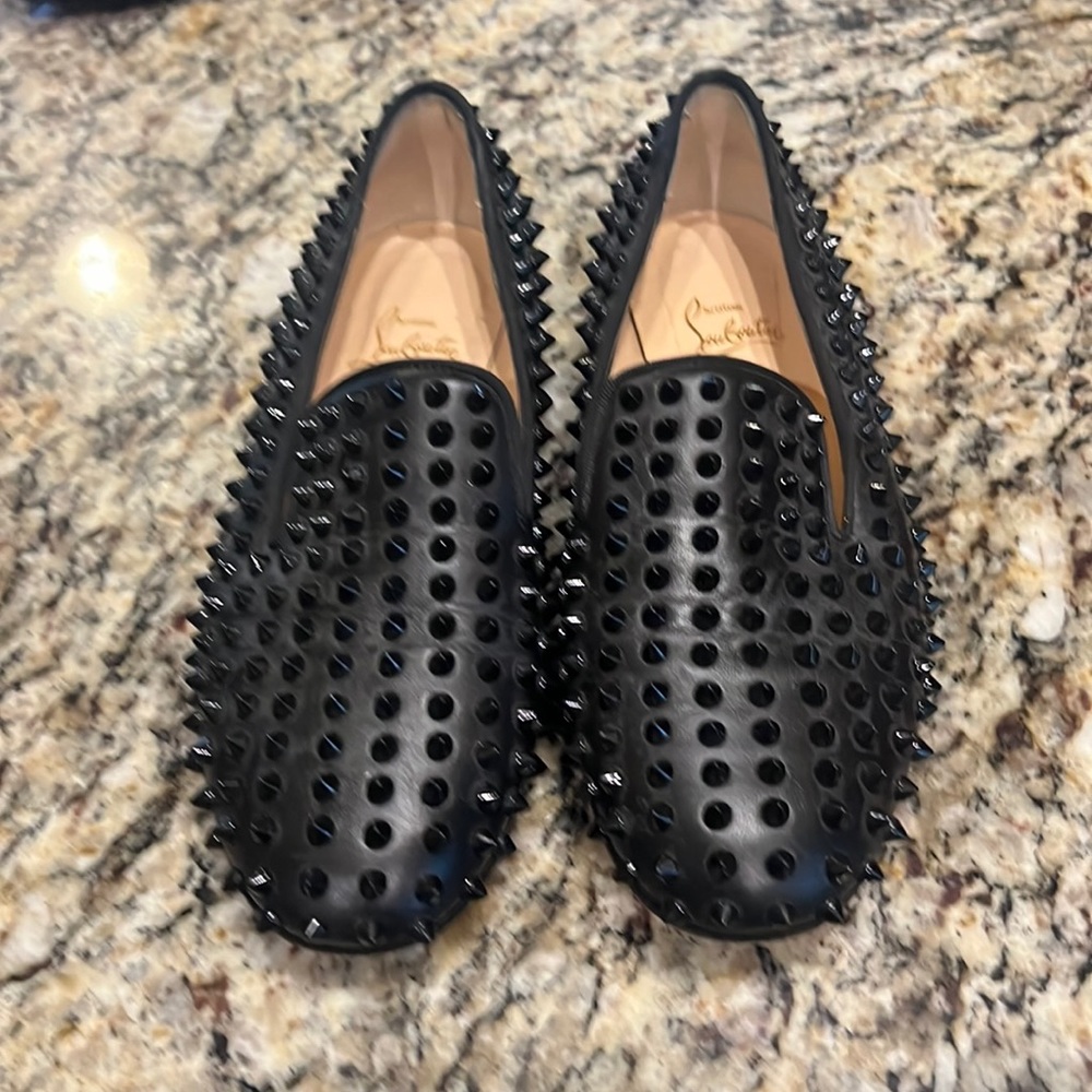 These are red bottoms loafers or flats black spikes all over.these are great buy